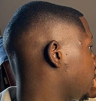Close side view of a beard fade finish
