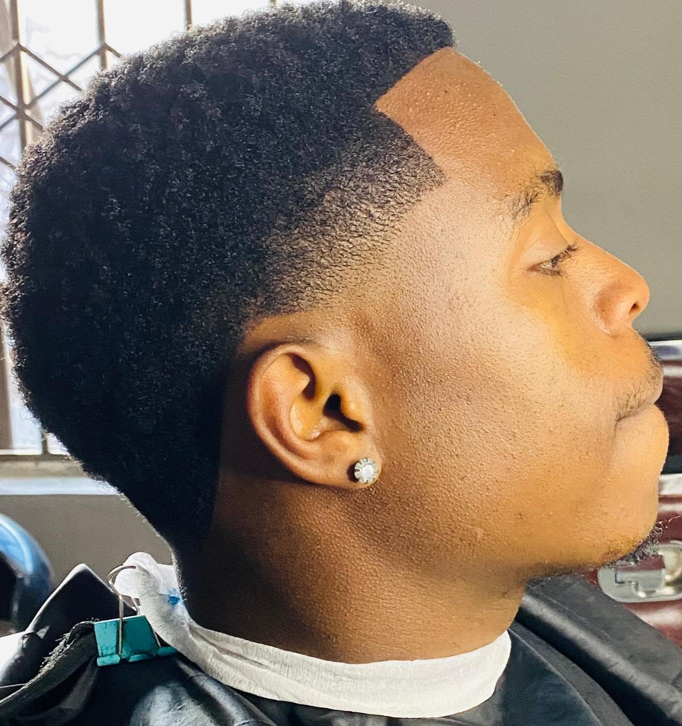 Side profile of an afro taper cut
