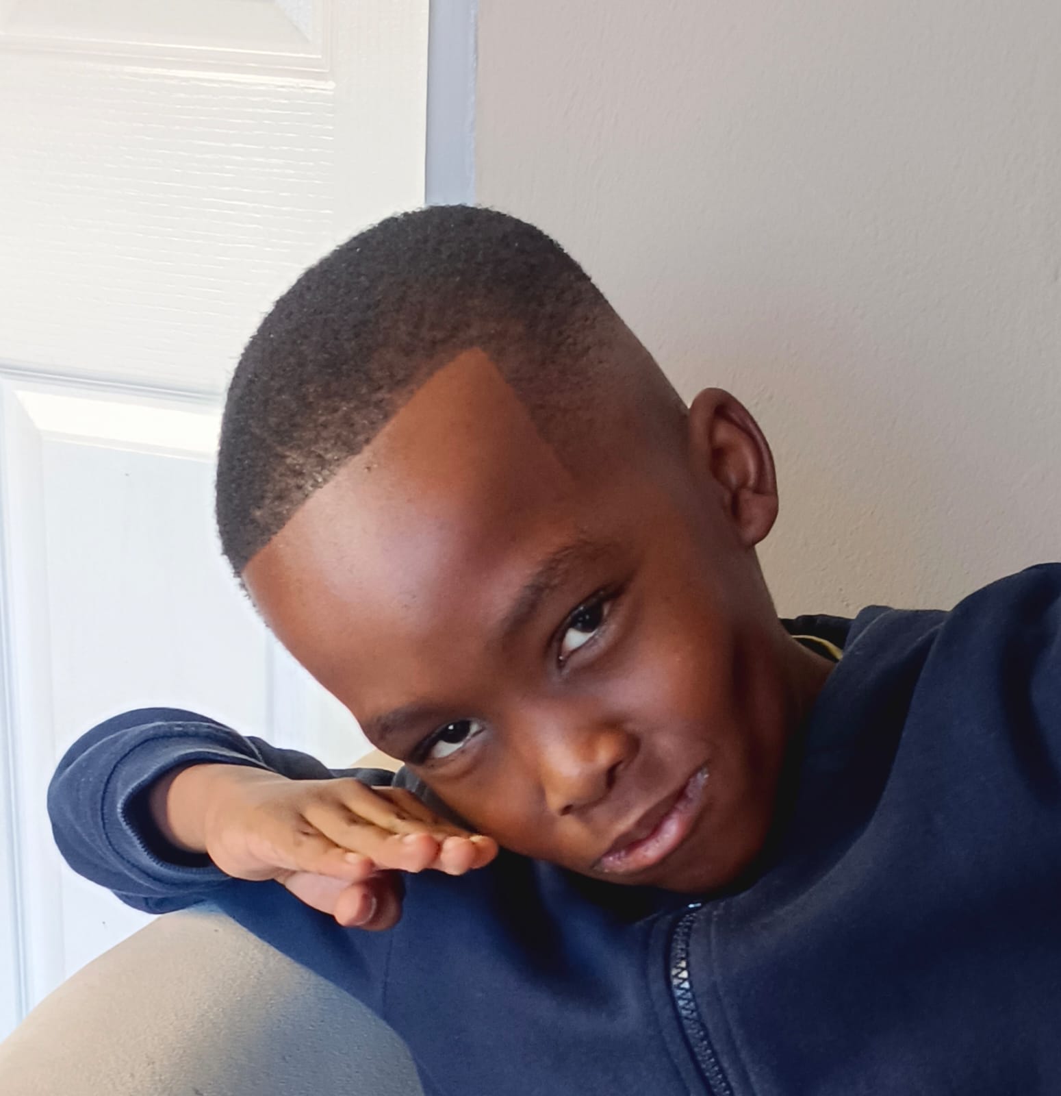 Young boy with a fresh brush cut and sharp line-up