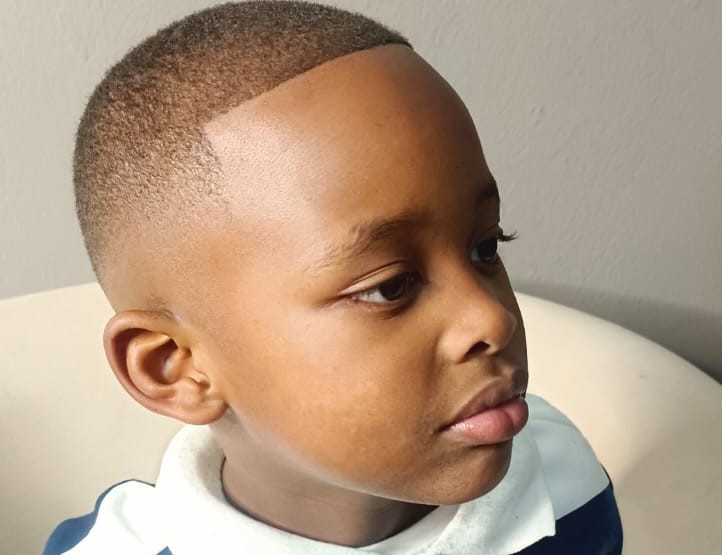 Young boy with a clean junior brush cut