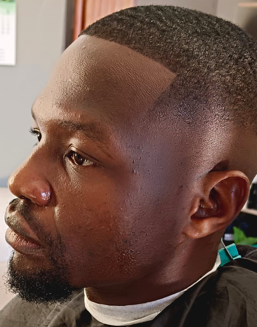 Close-up of a low fade haircut with sharp line-up