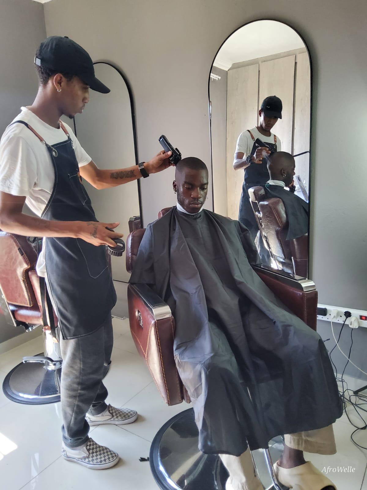 Barber cutting a client's hair